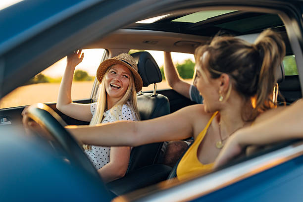 istock Two best friends have crazy fun during a summer vacation car trip 2225218309