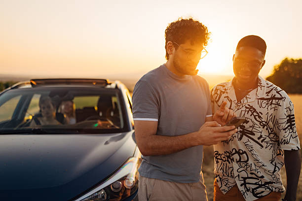 istock Lost on a road trip – two men checking map in rural area 2225218998