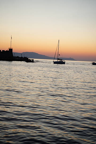 istock Serene Sunset Sailing Near Scenic Coastline 2225219342