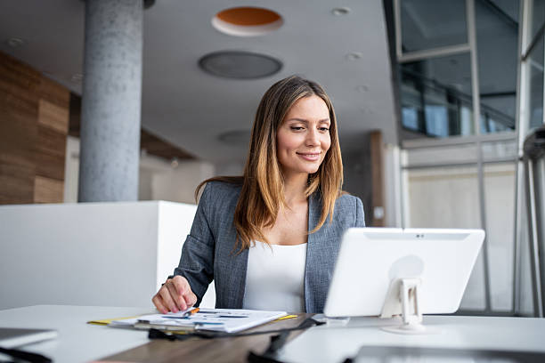 istock Businesswoman working with digital tablet and documents in modern office 2225219592