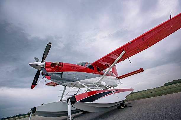 istock Low angle wide shot of red and white floatplane with a dramatic sky 2225220573