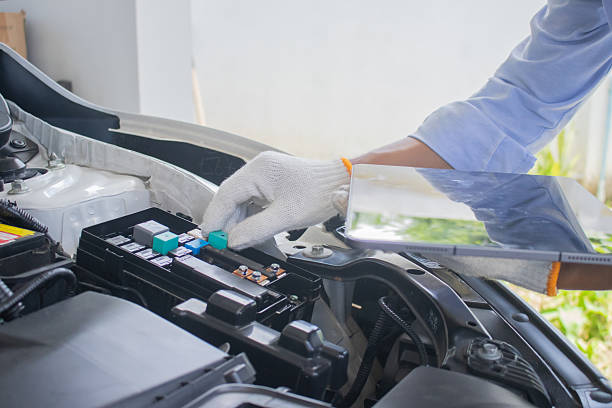 istock Technician in uniform inspecting car with clipboard, focusing on checklist, damage assessment, insurance claim, repair procedure, maintenance report, tools, transportation, expertise, service, office, work, safety 2225224098