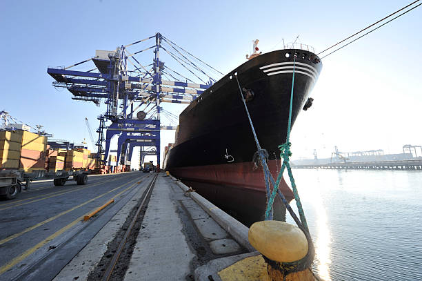 Aerial shot of a container ship arriving in the Port of Long Beach in California on a sunny day. \n\nAuthorization was obtained from the FAA and Port of Long Beach for this operation.