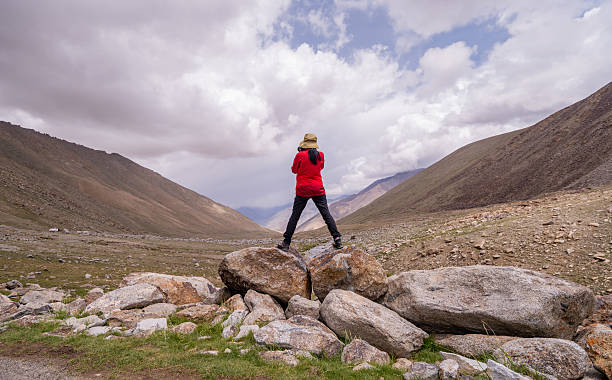 istock Hiker carefully frames the scene through a camera mountains during an adventurous hike emotional and visual experience that connects the traveler with the landscape. 2225224305