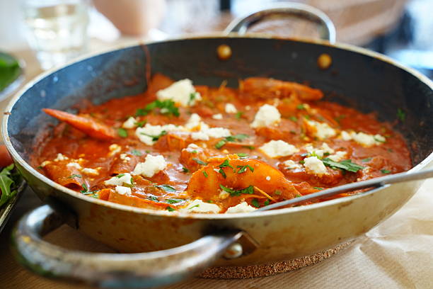 Pan of Shakshuka Simmering with Fresh Ingredients