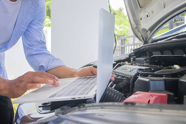 istock Technician in uniform inspecting car with clipboard, focusing on checklist, damage assessment, insurance claim, repair procedure, maintenance report, tools, transportation, expertise, service, office, work, safety 2225225521