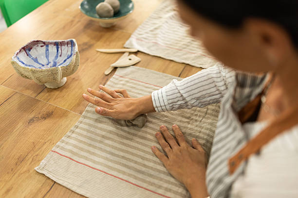istock Female artist making pottery in art studio 2225225654