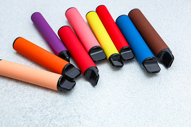 istock Colorful collection of vape pens arranged on a gray surface in a modern setting 2225226967
