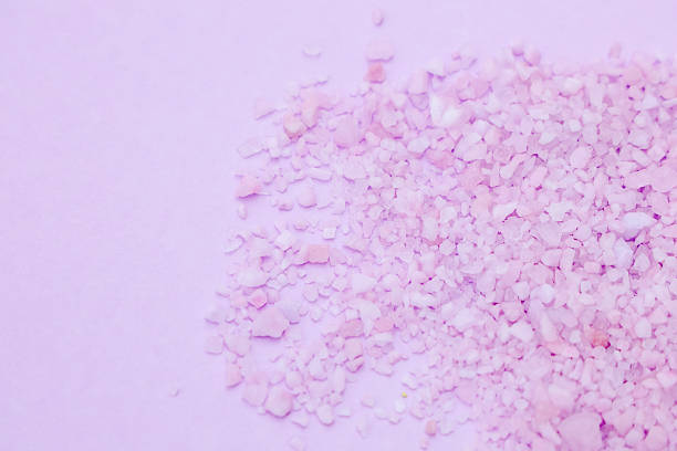 istock Pink salt crystals spread across a pastel surface create a calming aesthetic for relaxation 2225227008