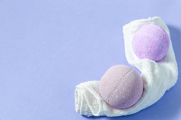 istock Relaxation essentials bath bombs on a towel against a pastel background 2225228596