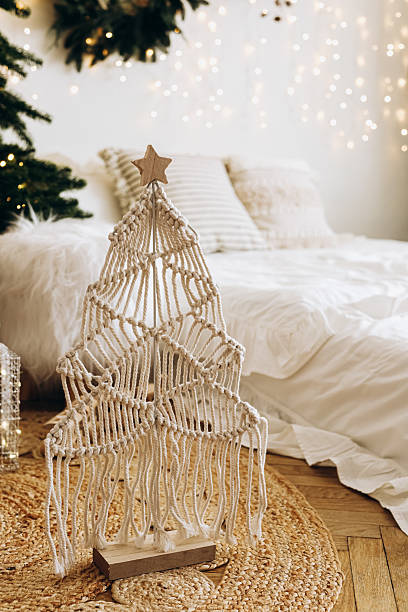 istock Unique macrame Christmas tree displayed in cozy bedroom with festive decorations 2225228825