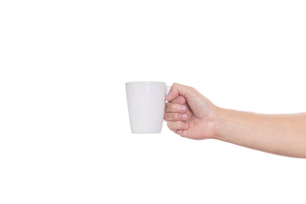 istock Hand holding a white ceramic coffee mug, a blank cup for your logo or design mockup. Perfect for branding, beverage concepts, or a morning drink, isolated on white background with clipping path. 2225229982