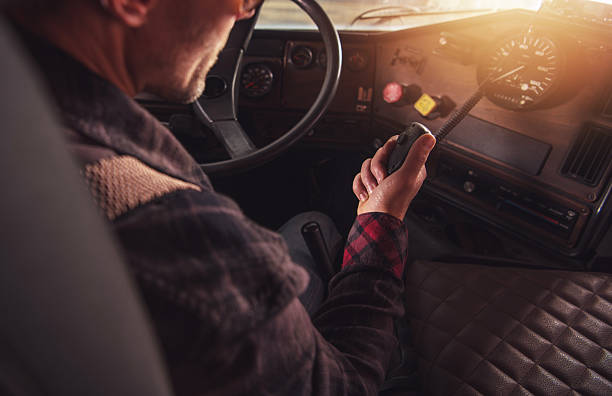 istock Driver Operating a Vintage Truck While Navigating a Scenic Route During Golden Hour 2225231189