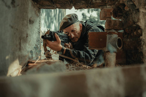 istock Tactical Soldier Aiming Rifle Through Ruins During Combat Operations 2225236031