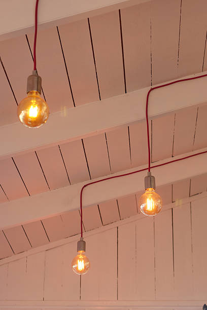 istock Hanging light bulbs with vintage design in a cozy space 2225239191