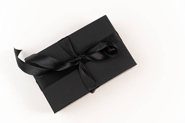 istock Black box with a black ribbon on a white background. Gift box, Elegant gift box with a black ribbon 2225241257