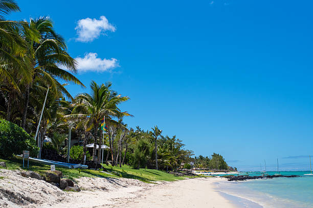 Beautiful landscape of Tropical Paradise - Belle Mare Beach stretches toward the Indian Ocean. Mauritius Island. Travel and vacation concept.