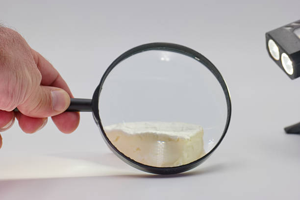 istock Exploring the details of a white substance under magnification with artificial lighting and a handheld lens 2225247282