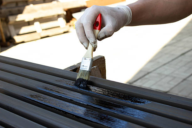 istock Painting Metal Surface with Brush and Protective Gloves 2225249422