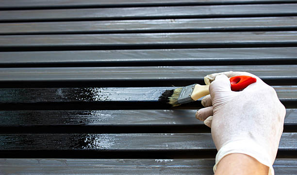 istock Painting Metal Surface with Brush and Protective Gloves 2225249432