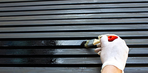 istock Painting Metal Surface with Brush and Protective Gloves 2225249435