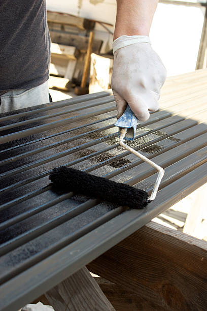 istock Painting Metal Surface with Paint Roller 2225249453