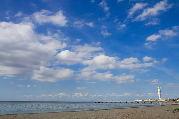 a large long pier on a sea beach