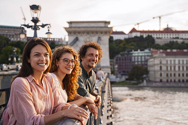 istock Tourists enjoying Budapest view from Chain Bridge at sunset 2225250980