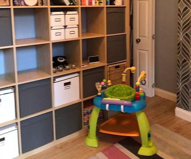 Green baby activity centre in home setting