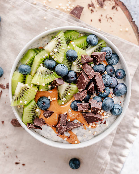 istock Chia yoghurt oatmeal breakfast bowl with toppings 2225259583