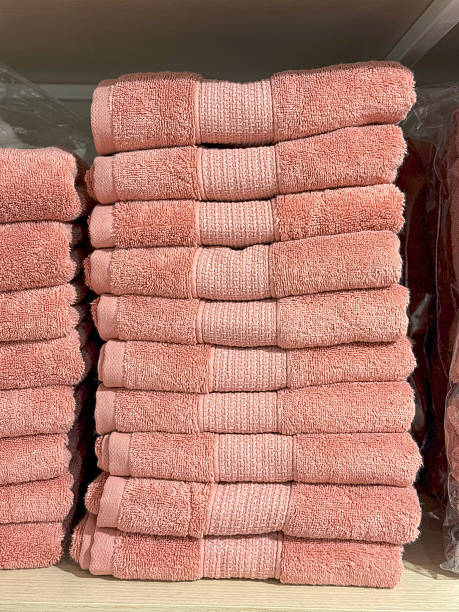 istock Folded Pink Towels with Decorative Banding, Organized Shelf Display 2225260609
