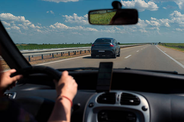 istock Woman driving modern car on the highway 2225260735