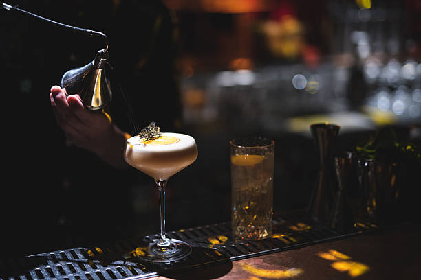 istock the bartender prepares a beautiful alcoholic cocktail at the bar counter 2225262751