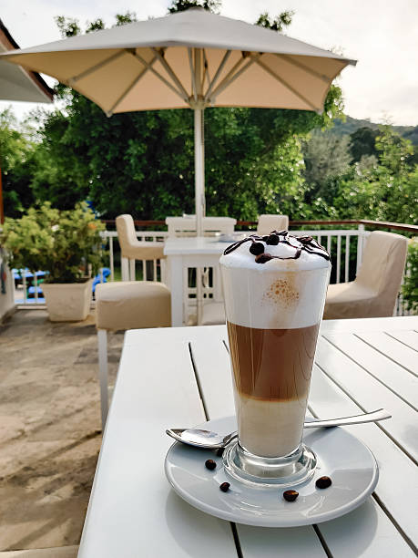 istock close-up of a three-layer coffee latte in a transparent glass 2225262819