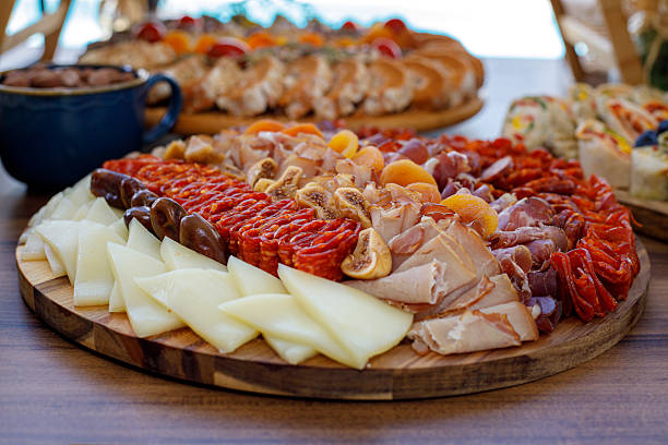 istock Charcuterie platter with assorted meats and cheeses at a gathering 2225263237