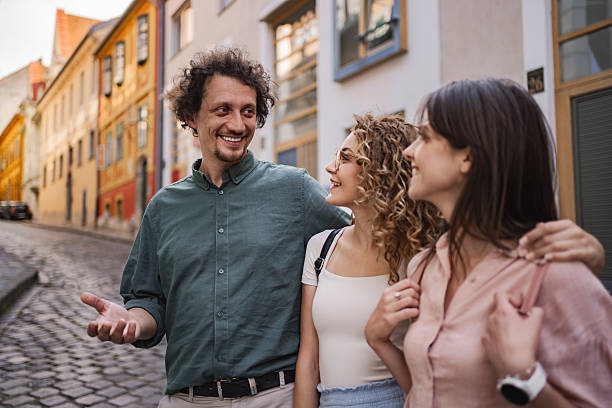 istock Tourist guide showing Budapest to two young women 2225263291