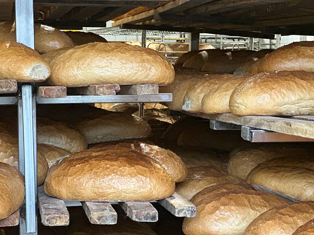 Loaves of freshly-baked artisan bread on display at a farmer's market