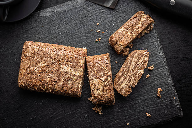 istock Halva with cocoa. Sweet oriental dessert on black table. 2225265954