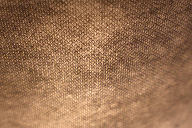 Close-up of a textured surface illuminated by warm, soft lighting for an inviting ambiance