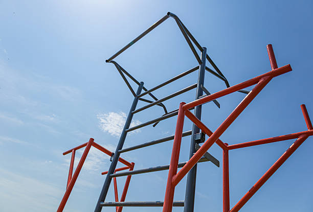 istock Athletes engage in workouts using parallel bars at a gym in a spacious outdoor area during bright daylight hours 2225270712