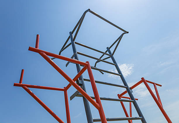 istock Brightly colored gym structure stands tall against a blue sky, supporting diverse workout activities for fitness enthusiasts 2225270717
