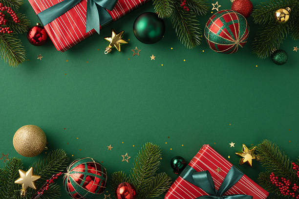 istock Beautiful holiday scene featuring decorative ornaments, gift boxes, and pine branches on a seasonal backdrop 2225270759