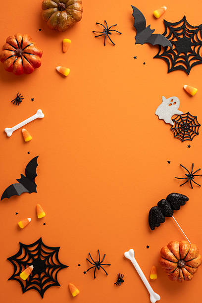 istock Festive Halloween vertical decorations featuring pumpkins, spiderwebs, candy corn, bats, and other elements 2225270818