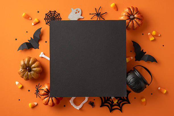 istock Festive Halloween arrangement featuring pumpkins, candy, bats, and spiders creating a spooky atmosphere 2225270820