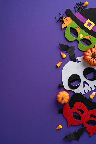 istock Festive and vibrant vertical Halloween masks with decorative elements on a purple surface to celebrate 2225270821
