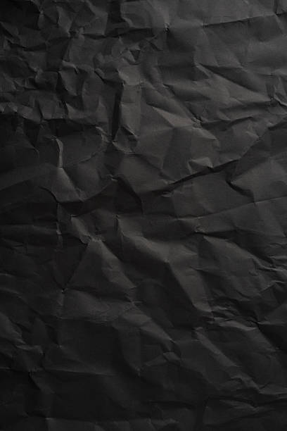 istock Brown vertical crumpled paper background showcasing deep folds and texture ideal for design projects 2225270824
