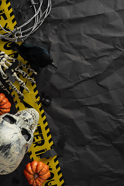 istock Festive vertical Halloween arrangement featuring a skull, pumpkins, and black spiders for spooky decor 2225270836