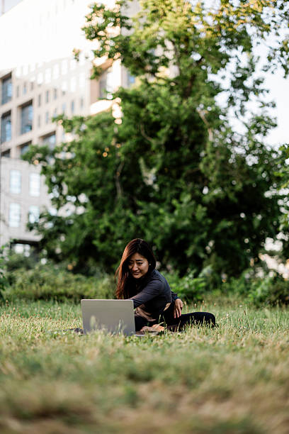 istock Online yoga class at park 2225271970