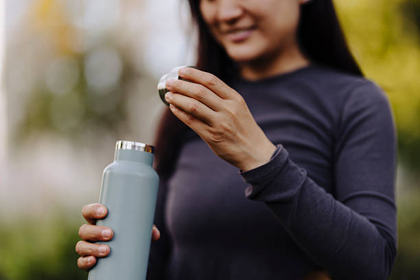 istock Sporty woman practicing and drinking water outdoor 2225272096