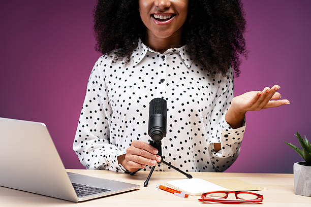 istock Radio host speaking with microphone and laptop in studio 2225273496